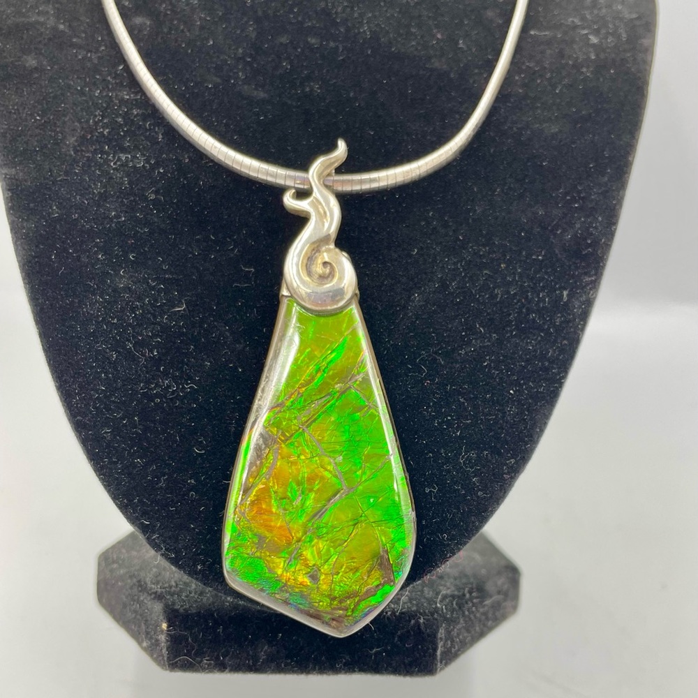Ammolite and sterling silver pendant and 18 in chain signed by artist Amy Newsom